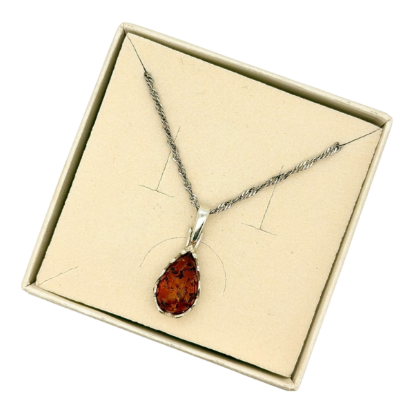 Wisiorek srebrny z koniakowym bursztynem - koronkowy