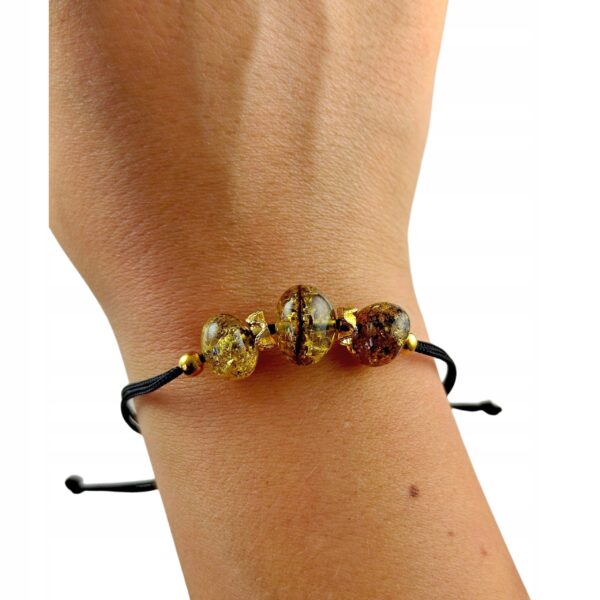 369d7a620779a670e8f1fcc63b646a6d.jpg Bransoletka złota ze stali z certyfikowanym bursztynem - regulowana