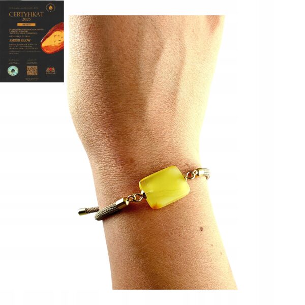 4831f38b92bb668509893014f262ff07.jpg Bransoletka na sznurku z naturalnym mlecznym bursztynem - regulowana
