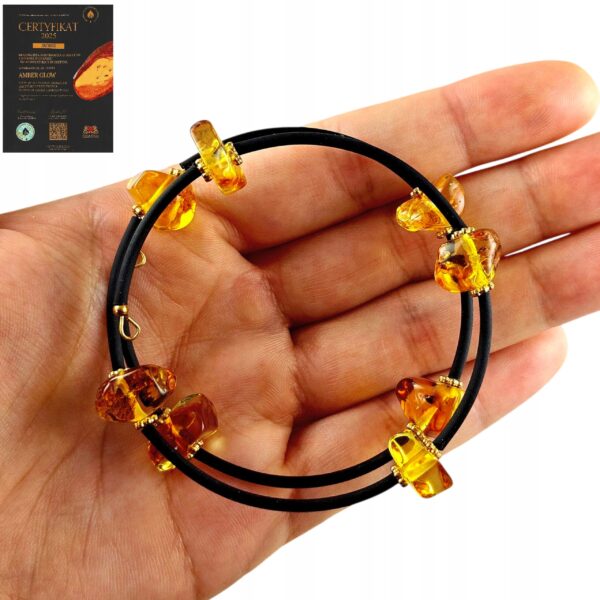 4ae2020c1a5f5d01f81f430fff01d0bb-1.jpg Bransoletka złota ze stali z certyfikowanym bursztynem - regulowana