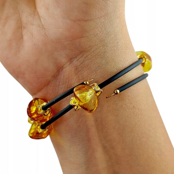 54188d3b36077d91384289d4df3a5e14.jpg Bransoletka złota ze stali z certyfikowanym bursztynem - regulowana