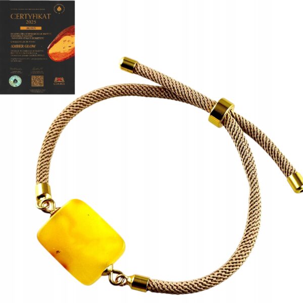 741181f573dcff773684166656bf2100.jpg Bransoletka na sznurku z naturalnym mlecznym bursztynem - regulowana