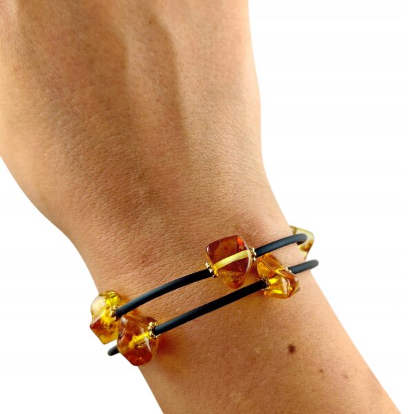 76414c8ce3cc1b2a6da87c1044275587-1.jpg Bransoletka złota ze stali z certyfikowanym bursztynem - regulowana