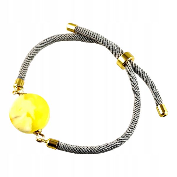 93b33b391b69b9d28da4ac941e26aeb2.jpg Bransoletka na sznurku z naturalnym mlecznym bursztynem - regulowana