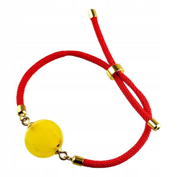 e9e13b3cb7e46f355c475c4234d01615.jpg Bransoletka na sznurku z naturalnym mlecznym bursztynem - regulowana