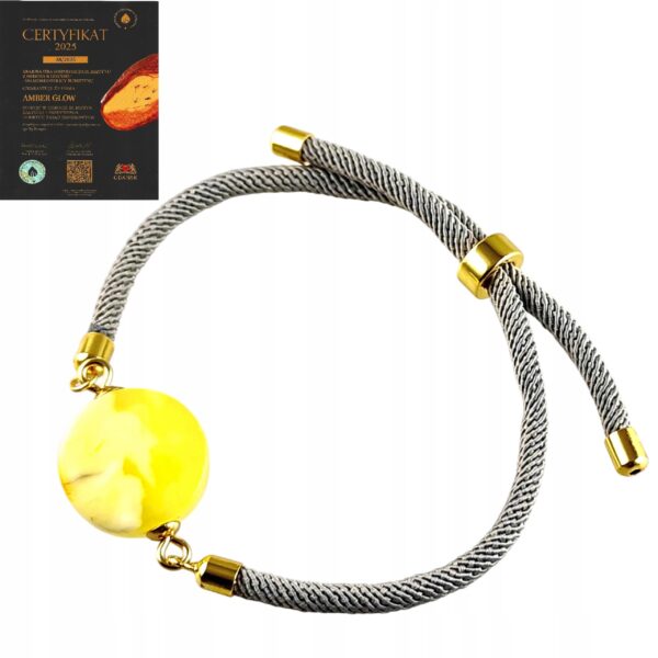 f29bb89bb03e1ede005bb78163083be6.jpg Bransoletka na sznurku z naturalnym mlecznym bursztynem - regulowana