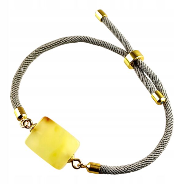f5358268b7fe21bca027ab827fcaf4dc.jpg Bransoletka na sznurku z naturalnym mlecznym bursztynem - regulowana