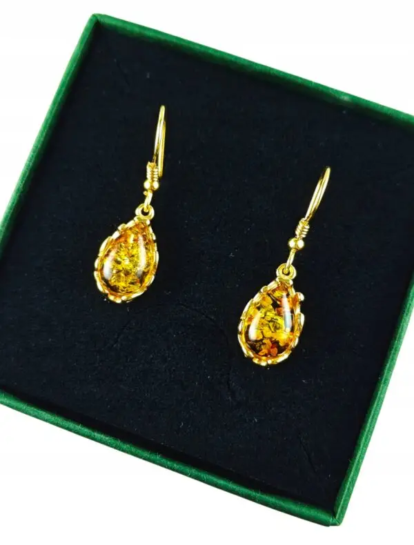 Kolczyki złote z bursztynem z koronkowym zdobieniem - srebro pozłacane