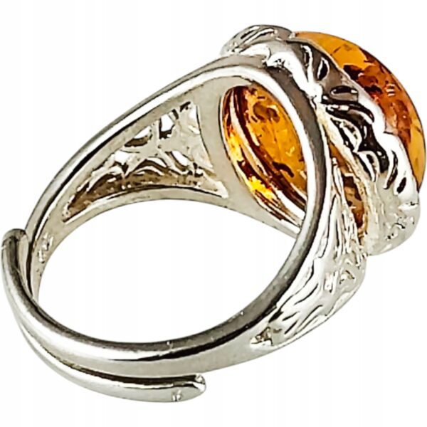 Pierścionek srebrny z bursztynem - okrągły z ażurowym zdobieniem