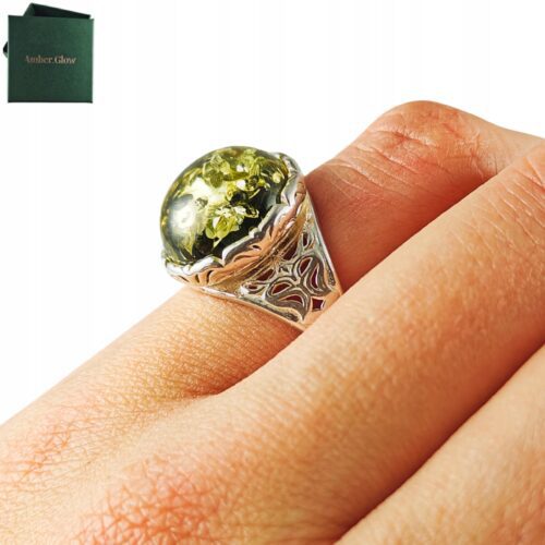 a51781d8ab0be7ab8faccce97d616e53.jpg Pierścionek srebrny z bursztynem - okrągły z ażurowym zdobieniem