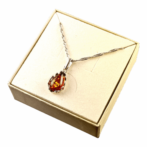 6de3bfed8d61dcfeed3d4bbd3fe014e5-1.png Wisiorek srebrny z koniakowym bursztynem - koronkowy