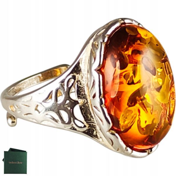 Pierścionek srebrny z bursztynem - owalny z ażurowym zdobieniem