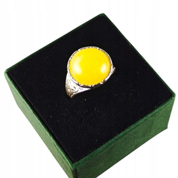 Pierścionek srebrny z bursztynem - okrągły z ażurowym zdobieniem